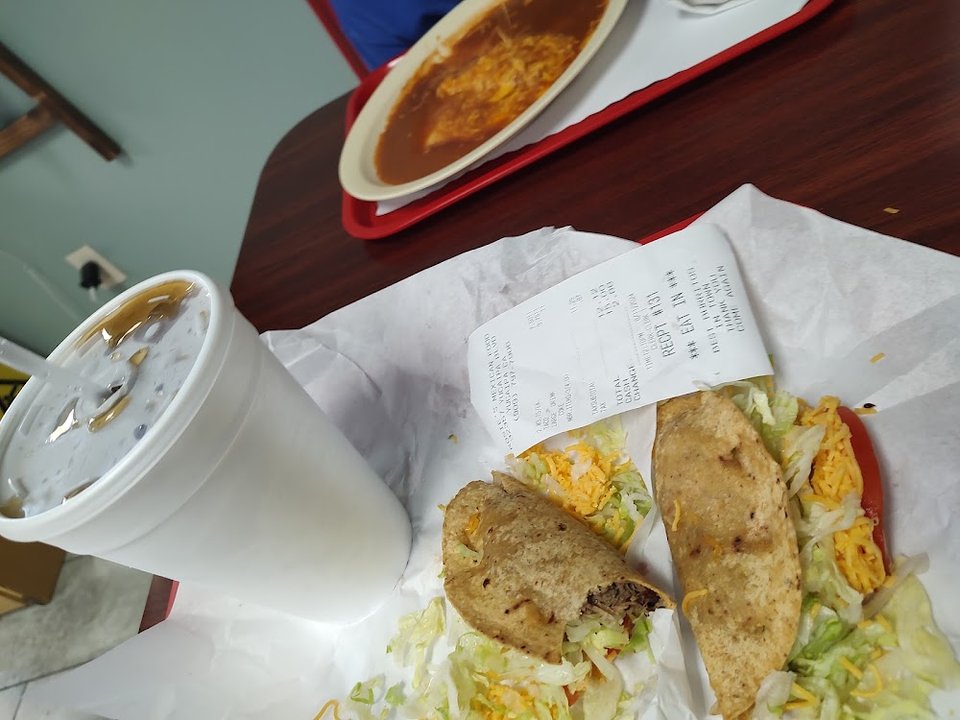 Printed menu with salsa and Mexican dishes.